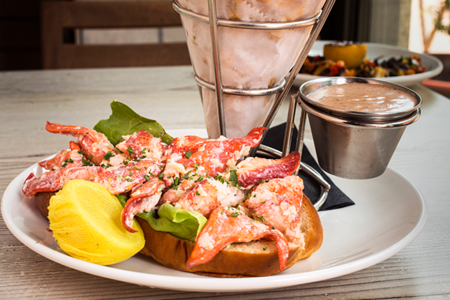 Frankie's lobster roll features chunks of claw meat lightly tossed in lemon garlic aioli on a toasted split-top brioche bun.