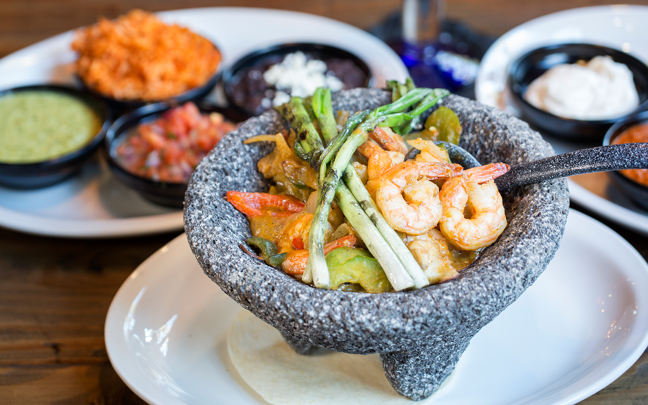Vuelo's "bubbling molcajete" of shrimp, bay scallops, catfish and snapper in tomato-seafood broth.