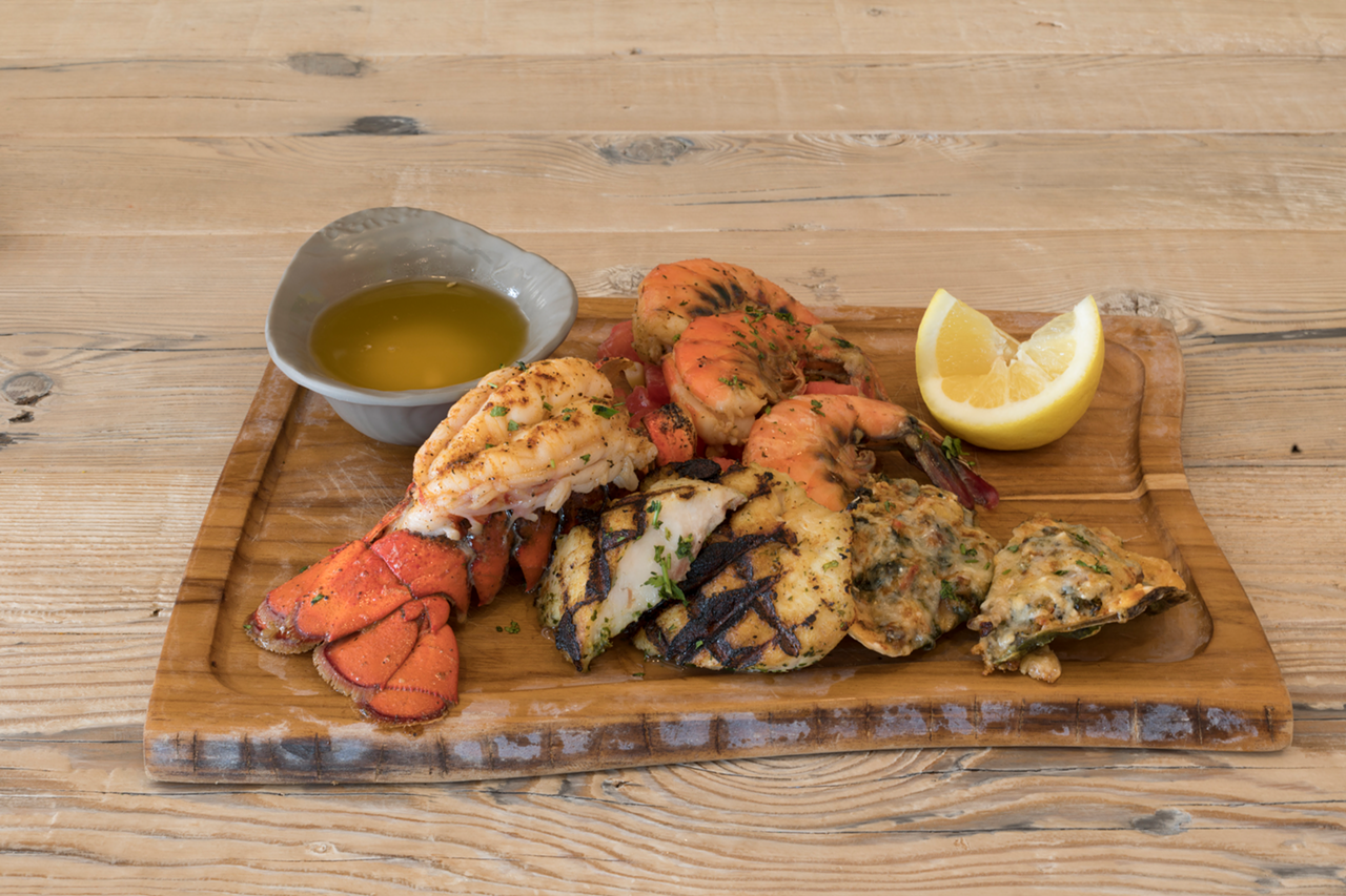 Seafood roast — featuring cold water lobster, shrimp, fish and "oysters lobsterfeller" — is a fresh board of Poseidon's greatest hits.