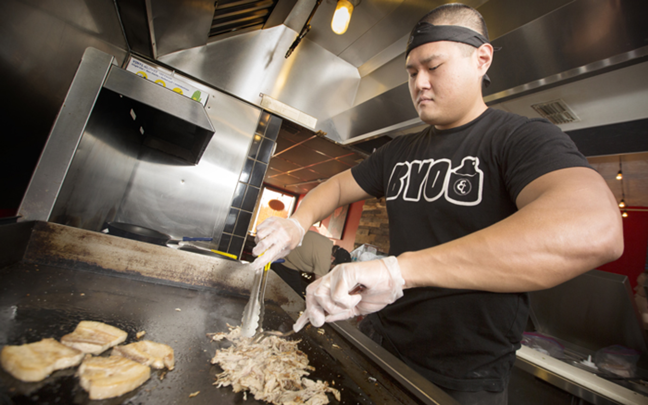 Steve Sera, co-owner of Chop Chop Shop, prepares pork belly.