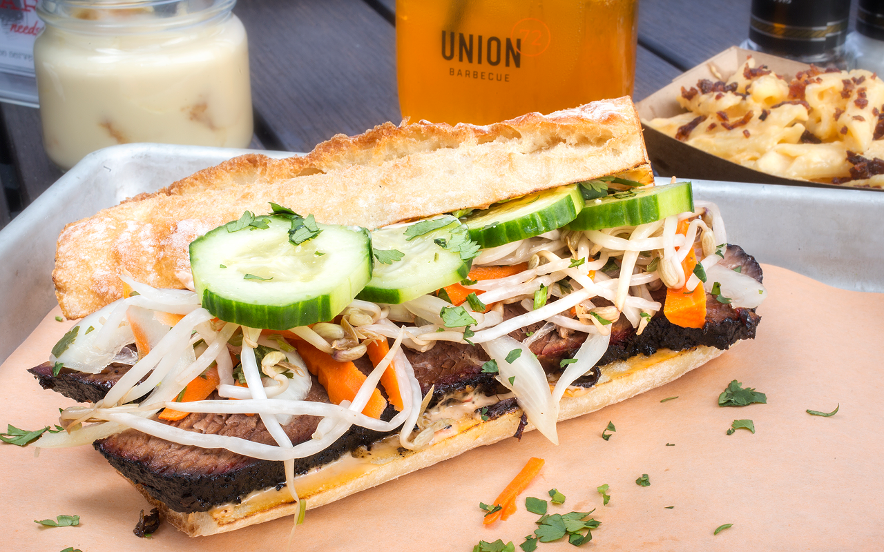 UNION72's bánh mì is layered with smoked brisket, pickled veggies, cukes, sprouts and spicy aioli.