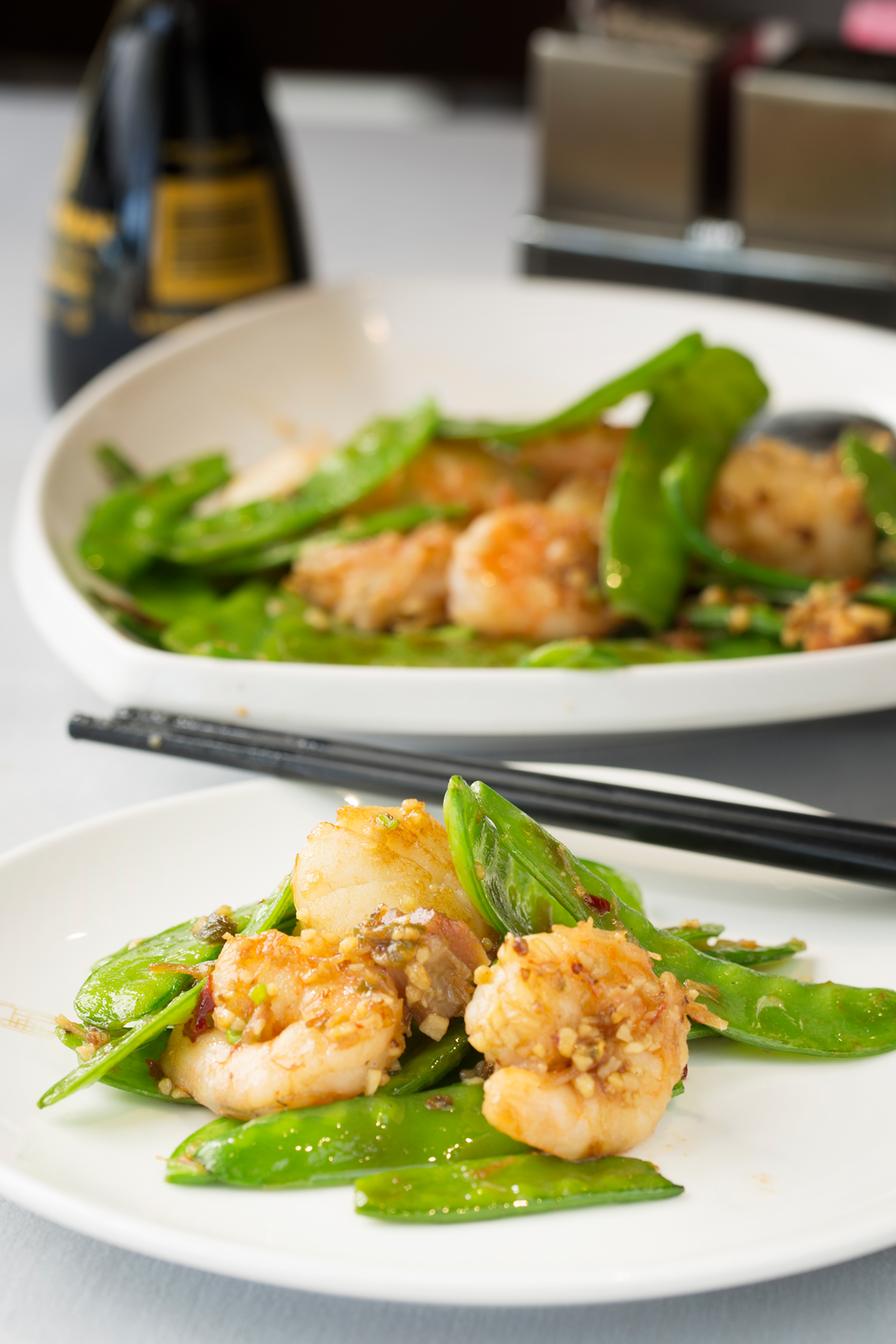 Sautéed scallops and shrimp with snow peas and mushroom in spicy sauce.