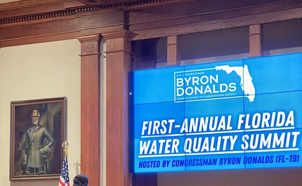 U.S. Rep. Byron Donalds addresses his secret water quality summit in the Lee County Commission chambers (note the portrait of Robert E. Lee),