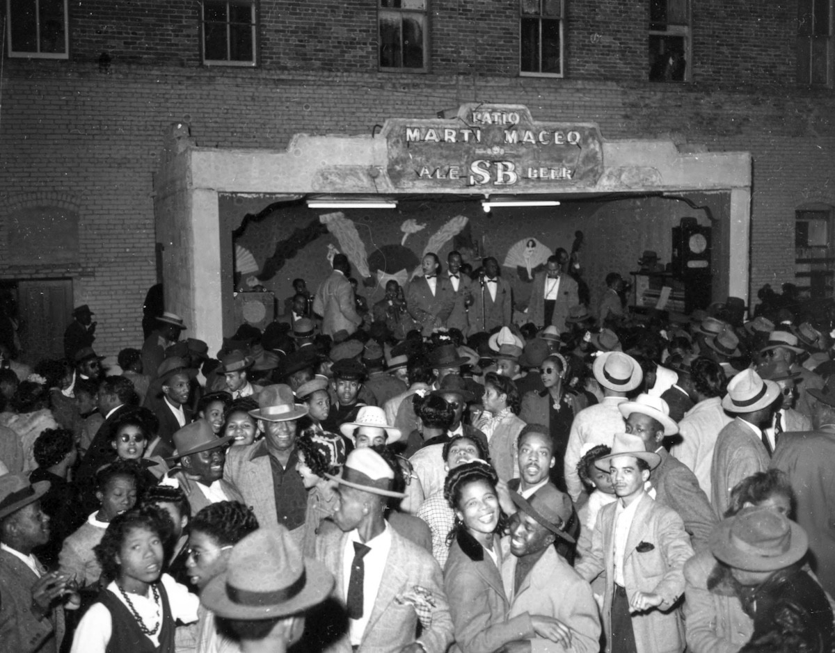 A large group of people at the Marti Maceo Patio in January 1940.