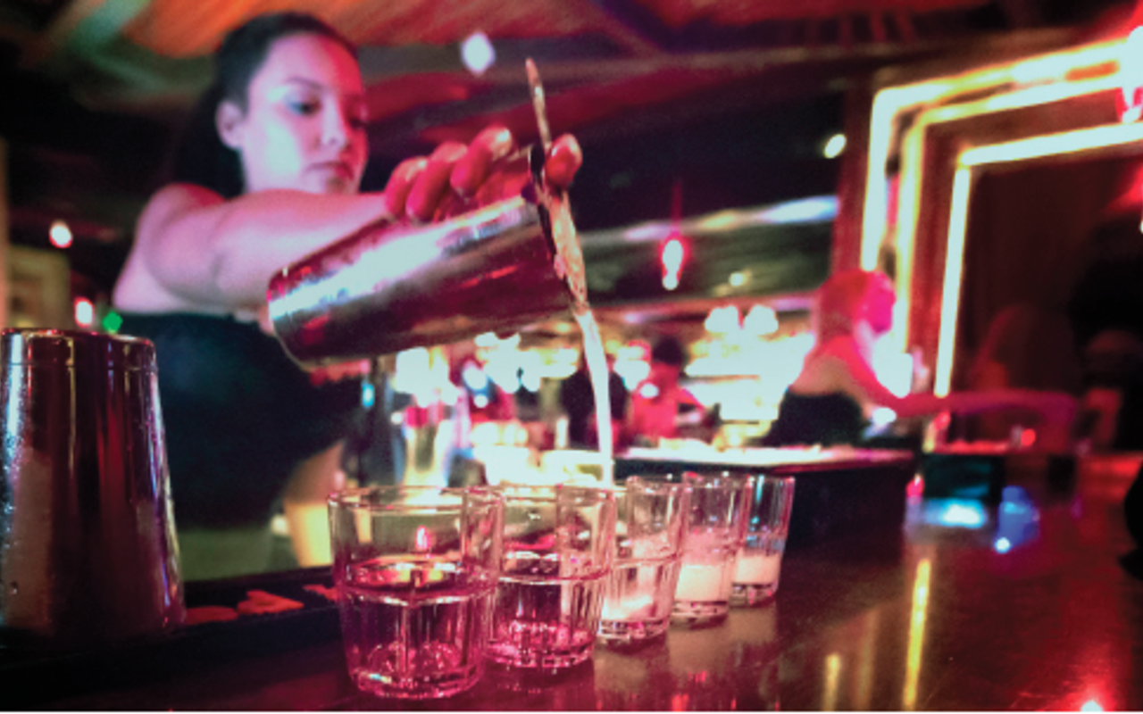 BOTTOMS UP: Bartender Chelsea Barrios pours a round at The Kennedy.