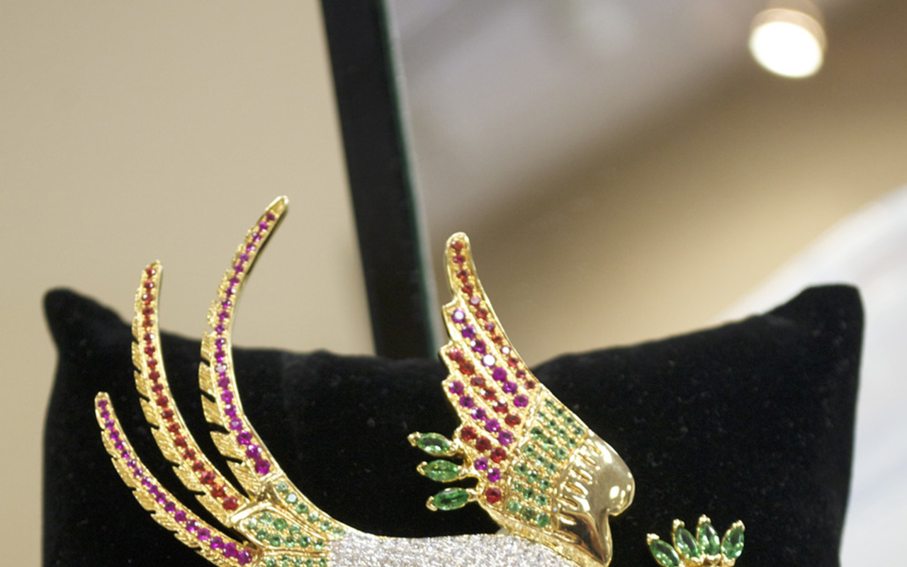 THE CROWN JEWEL: Baubles & Bubbles’ 14-karat gold bird pin with two carats of white diamonds in the body.