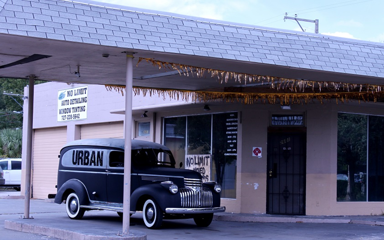 Salyards' Urban mobile (an early '40s Chevy Suburban) sits in front of his newest resto project, Urban Comfort.