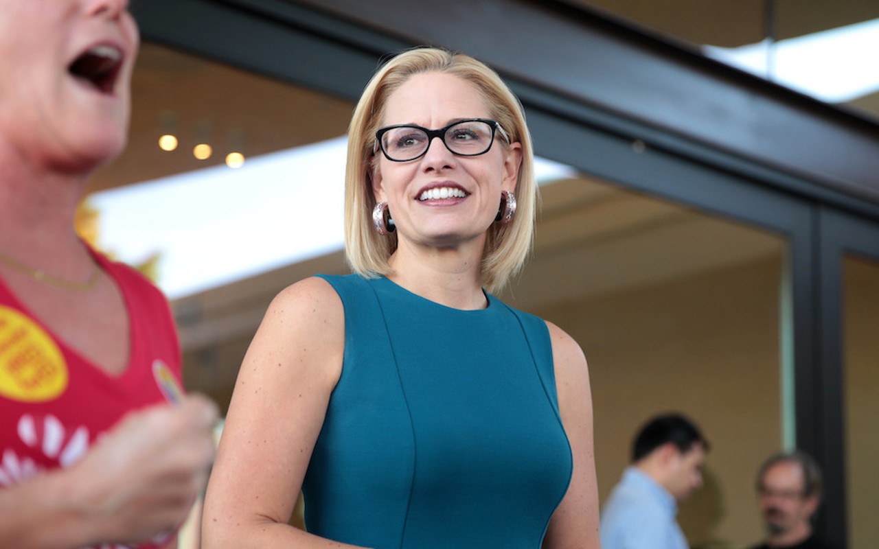 U.S. Congresswoman Kyrsten Sinema speaking with supporters at a neighborhood canvas hosted by the Arizona Education Association at Provision Coffee Arcadia in Phoenix, Arizona.