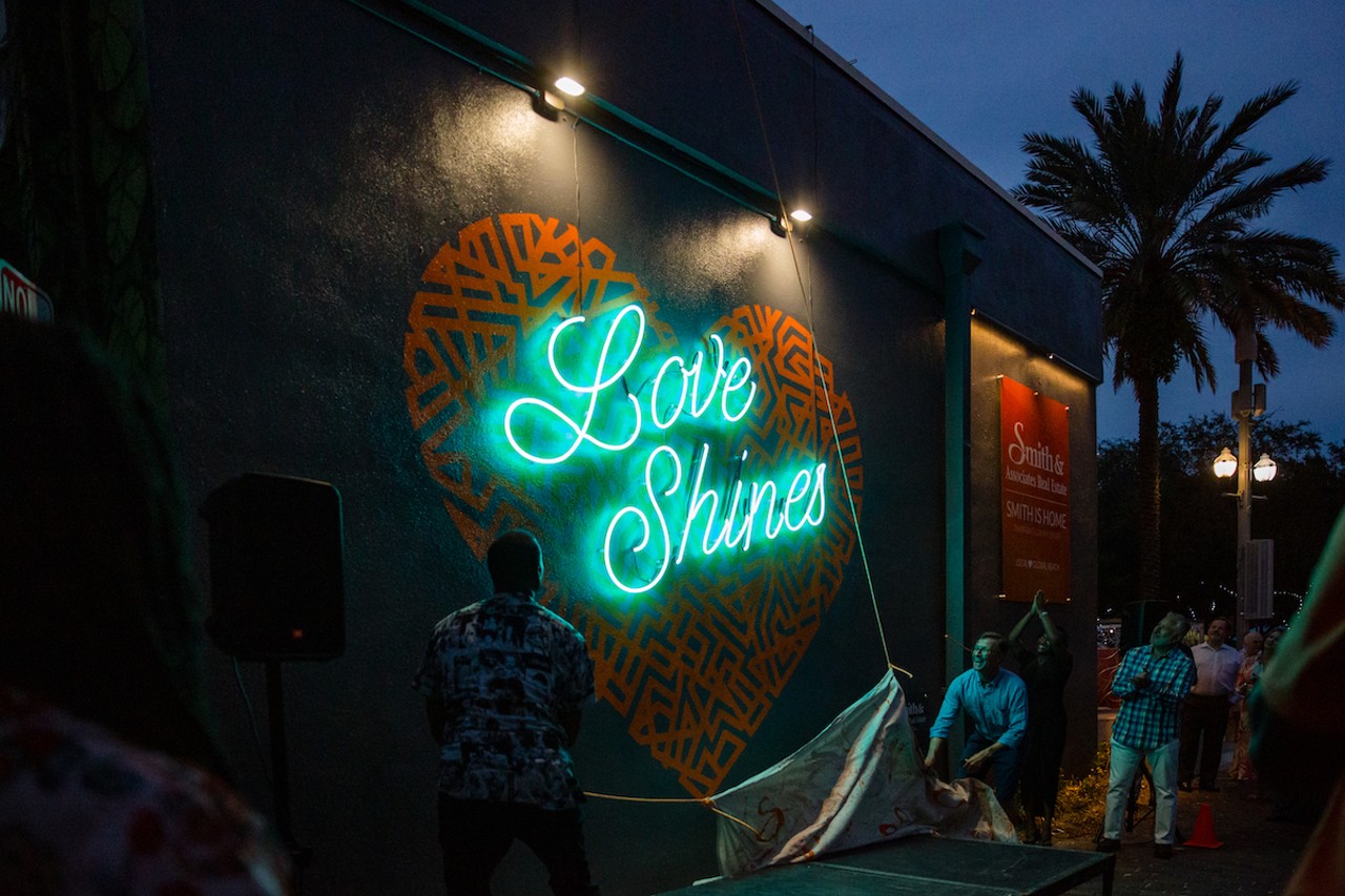 The luxury real estate offices have sponsored several of St. Pete’s best murals, including “Love Shines,” which Ya La’ford painted next to Donnelly’s St. Pete postcard mural in 2021
Photo via cityofstpete/Flickr