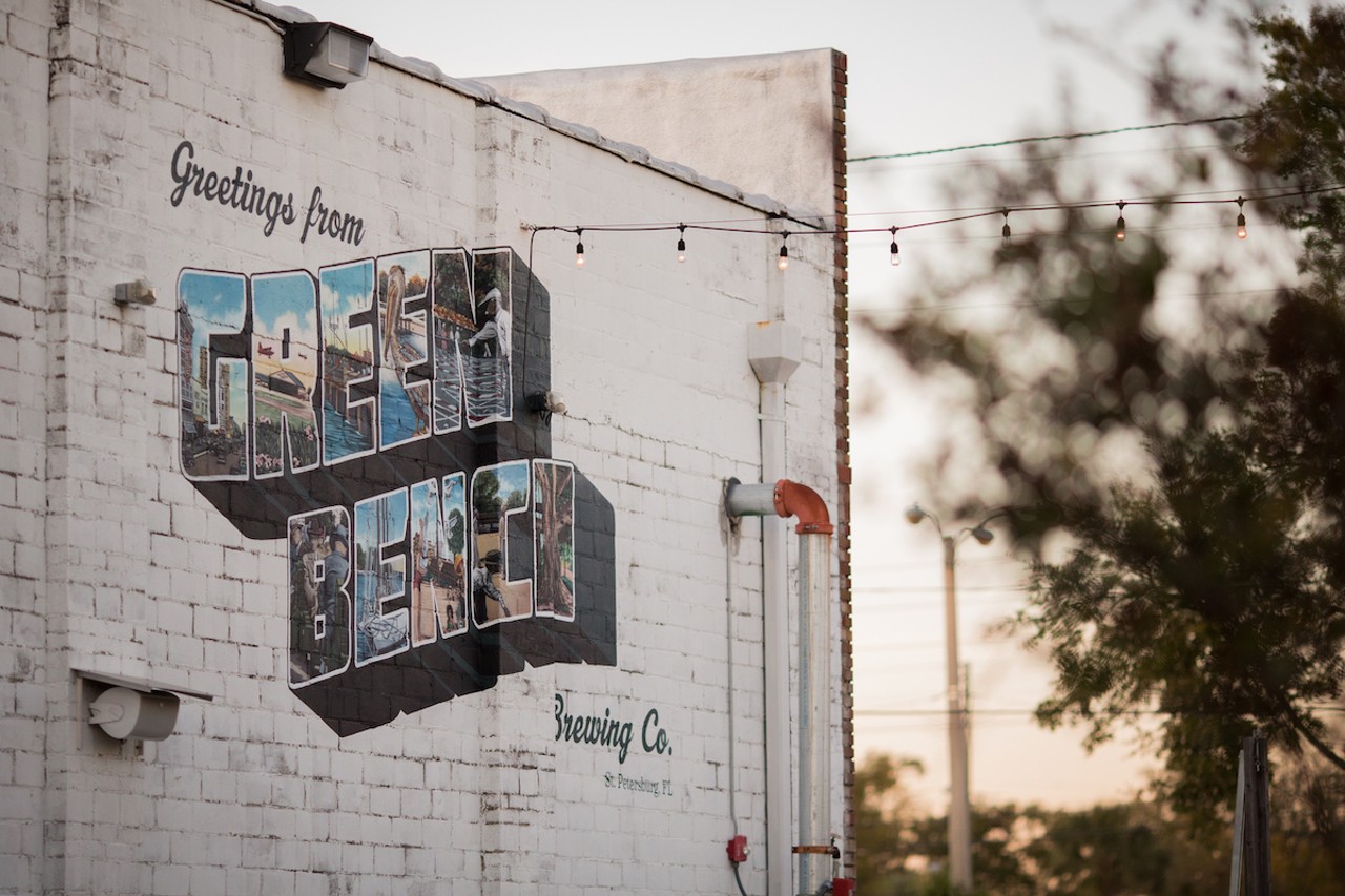 Matt Callahan’s Green Bench Brewing postcard mural is as iconic as St. Pete’s green benches
1133 Baum Ave. N, St. Petersburg
Within the beautiful block letters of Green Bench, Callahan somehow managed to paint the entire City of St. Pete: pelicans, gulf, banyan trees, downtown, and all. Drink it in with a cold glass of beer.Photo  via cityofstpete/Flickr