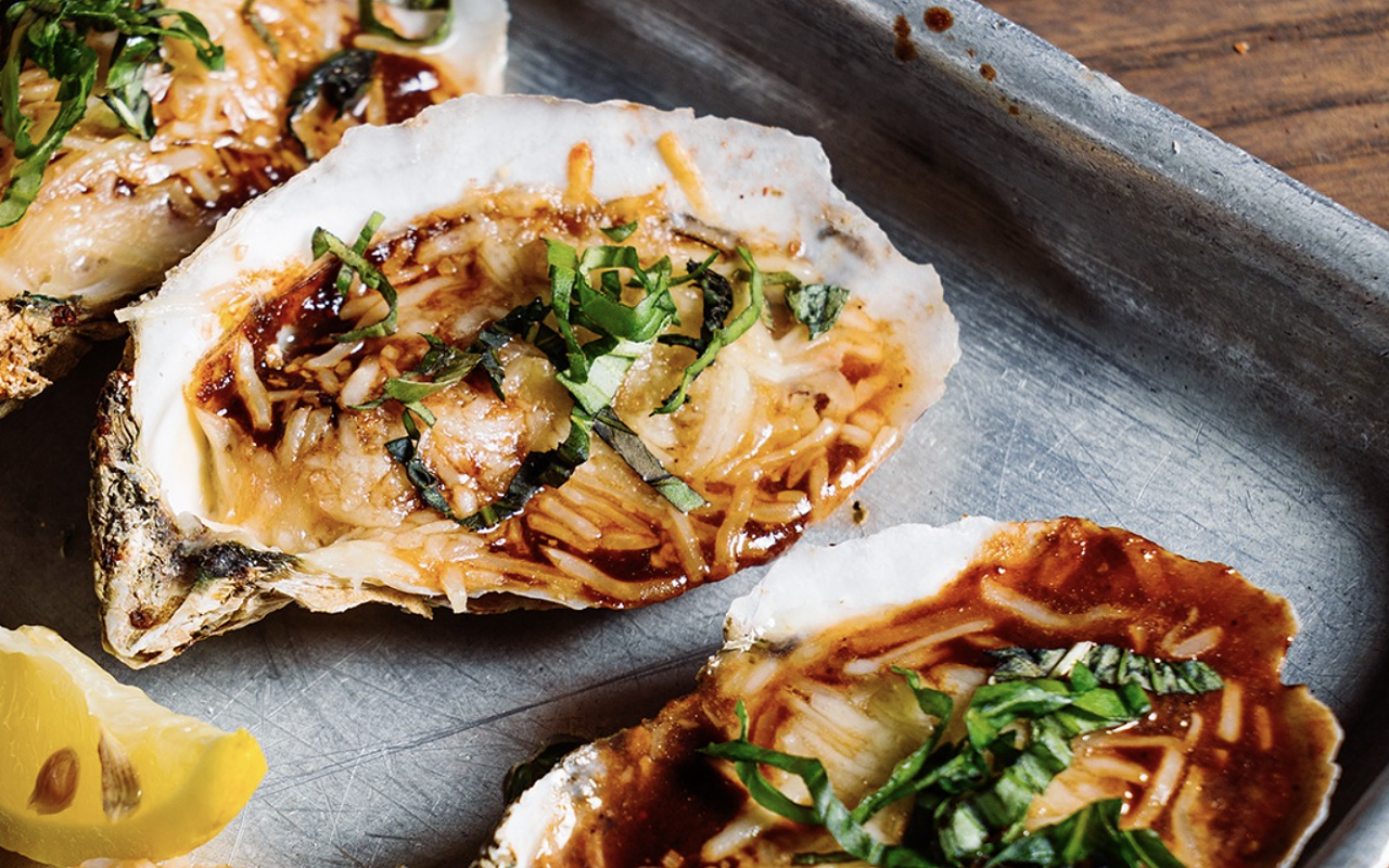 Shuckin' Shack's charbroiled oysters can be topped with parmesan cheese, garlic and bacon.