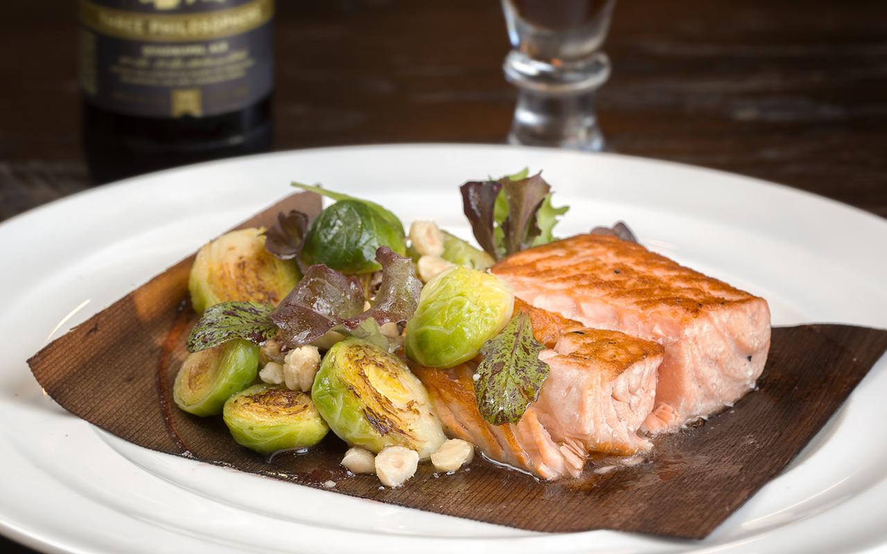 ONE FISH: Élevage’s cedar plank salmon with Brussels sprouts, hazelnuts and apple Lambic fruit beer glaze.