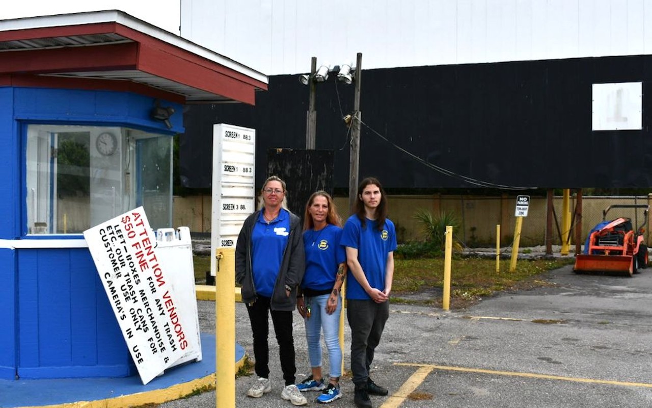 Fun-Lan workers stand next to the original ticket booth on their last day of work on the property. From left to right: Snell, Stanford and Perez.
