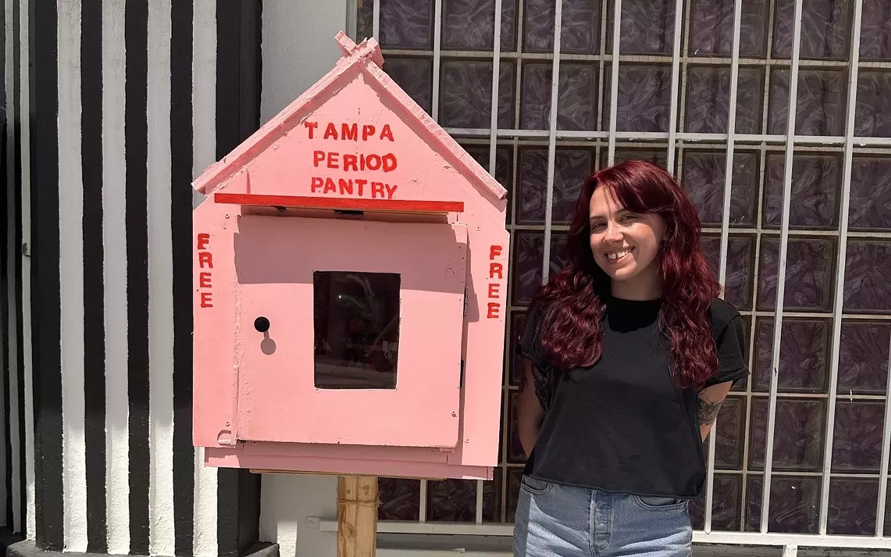 Founder Bree Wallace poses in front of the first pantry located at 4220 N Florida Ave. in Seminole Heights.