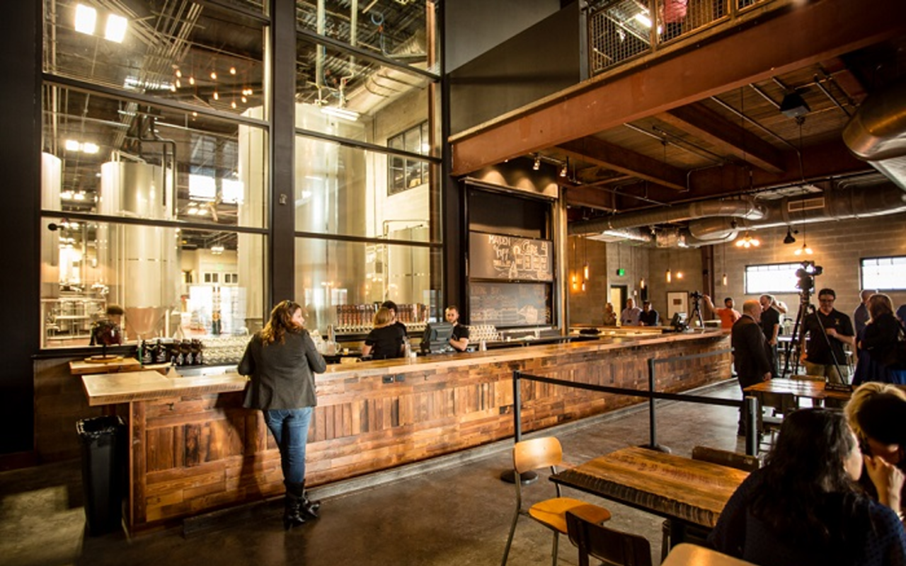 Coppertail's tasting room features tall windows that look into its brewhouse.