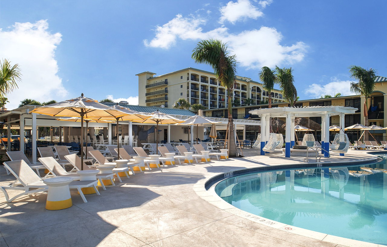 Harry’s Beach Bar  
5300 Gulf Blvd., St. Pete Beach, 727-363-5125
With rows of shaded loungers, a covered outdoor bar, swings, a pool and live music, direct access to the beach is only one of many amenities at Harry’s Beach Bar. Located in the Sirata Beach Resort & Conference Center, Harry’s says it's the oldest beach bar on St. Pete Beach. Serving a unique selection of fruity and frozen cocktails, virgin options are available for the kids, too.
Photo via Photo via Harry’s Beach Bar/Facebook