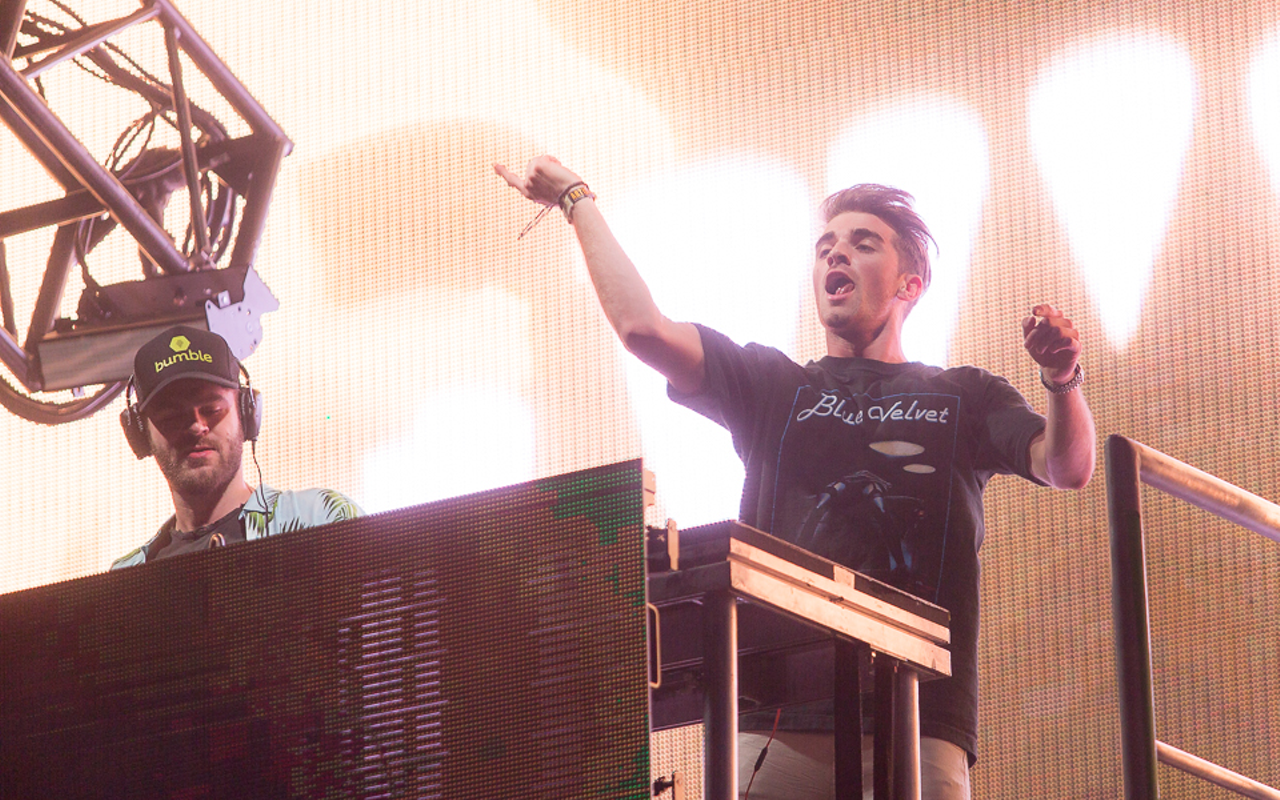 A photo of the Chainsmokers, an EDM duo, pictured playing music from their computers.
