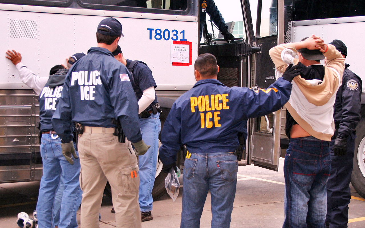 THE ICE MEN : Special agents from U.S. Immigration and Customs Enforcement arrest suspects during a raid.