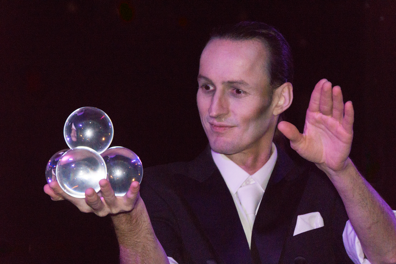 Kenny Toombs, contact juggler, entertains guests at the third-floor Spirit Bar.