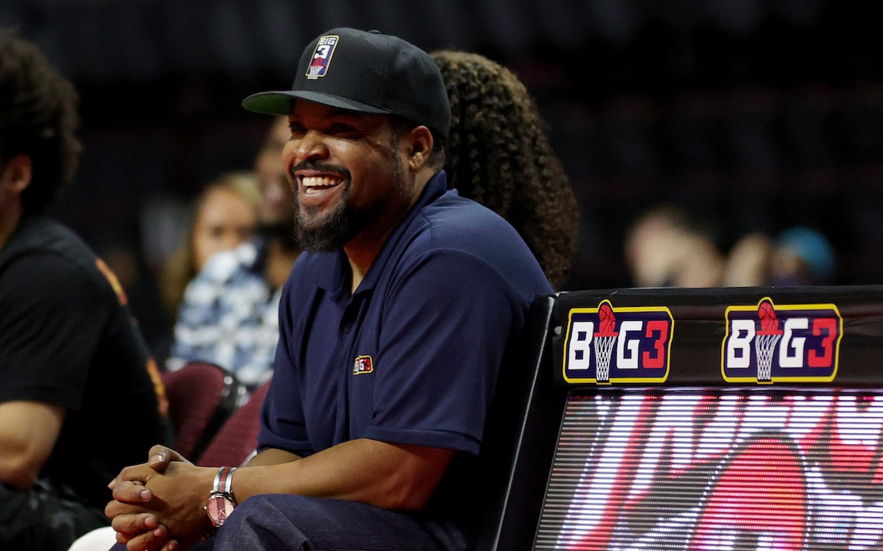 Ice Cube smiles as he watches a BIG3 game.