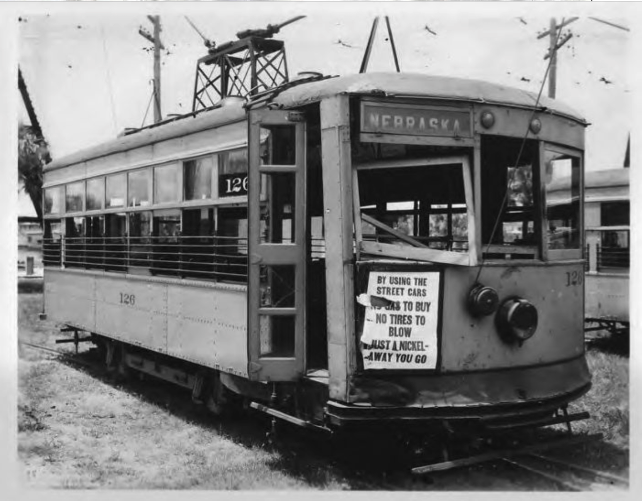 Streetcar, Nebraska Line Car #126, damaged in accident, front and side view, includes rhymed advertising poster extolling trolley use in Tampa, Fla. on July 7, 1928.
Photo by Burgert Brothers via Tampa-Hillsborough County Public Library System