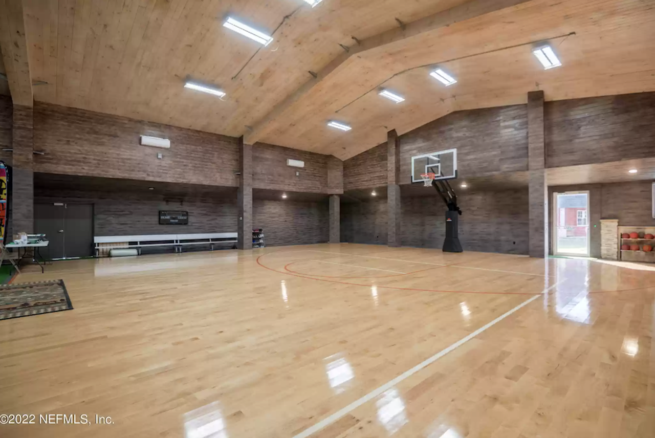 This Florida house is basically a mini resort, and includes its own golf course and an indoor basketball court