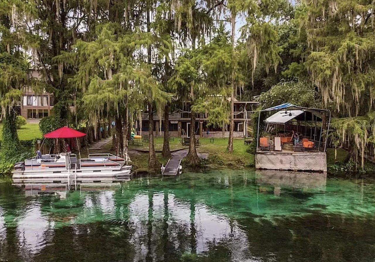 This Florida spring home sleeps 40 and comes with a pile of kayaks and a pontoon boat