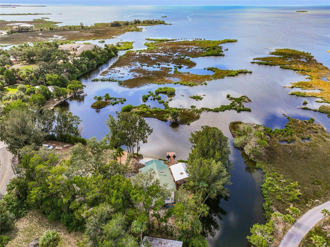 This secluded Tampa Bay home comes with its own beach and two private islands