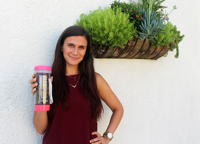 Teami Blends CEO and co-founder Adi Halevy with her pink Teami tumbler. - Meaghan Habuda