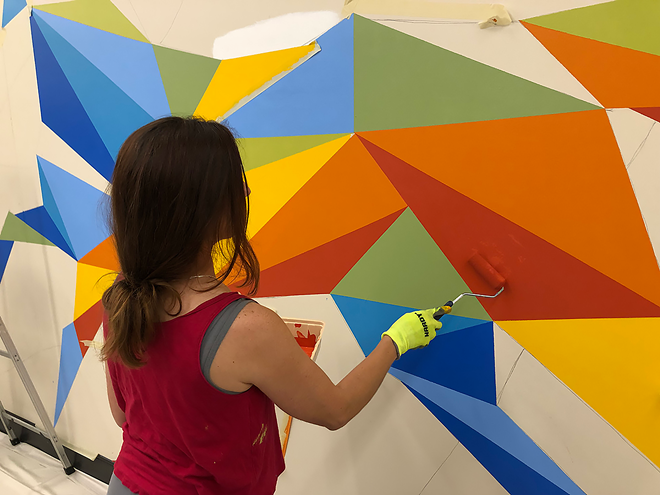 Cecilia Lueza working on mural in the James Museum's Children's Studio. - Courtesy of the James Museum