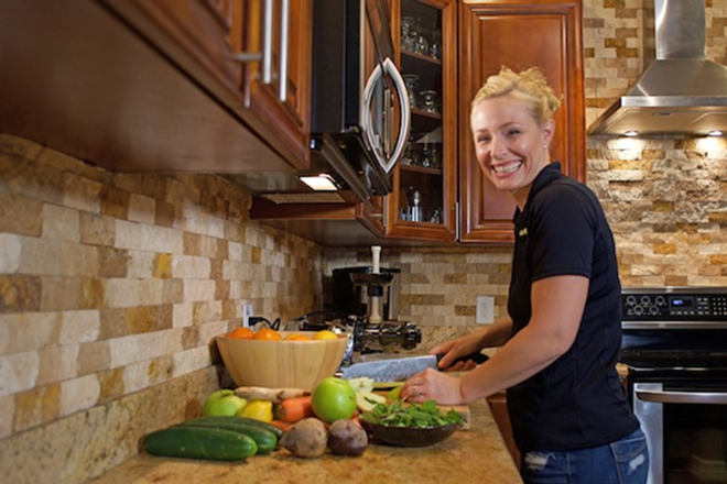 JUICING MACHINE: Gush co-founder Kristen Thomas says she tries to make magic with her juice. - Kevin Tighe