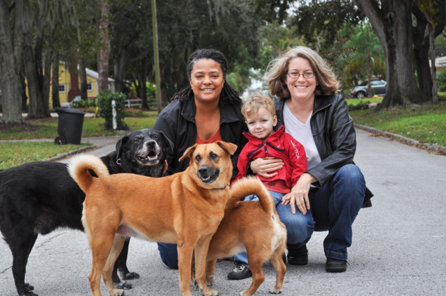 Smith with her wife, Andrea Hildebran, their son, Logan, and some four-legged friends in 2014. - Heidi Kurpiela