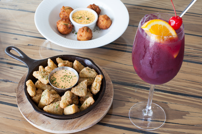 Delightful fried green tomatoes (bottom left), hush puppies and a glass of red sangria. - Nicole Abbett