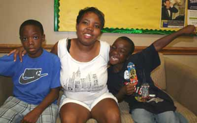 "JUST START": Tomeka Oliver with her sons Rashawn (left) and Jalan Douglas at the student union at USF St. Pete. - Eric Snider