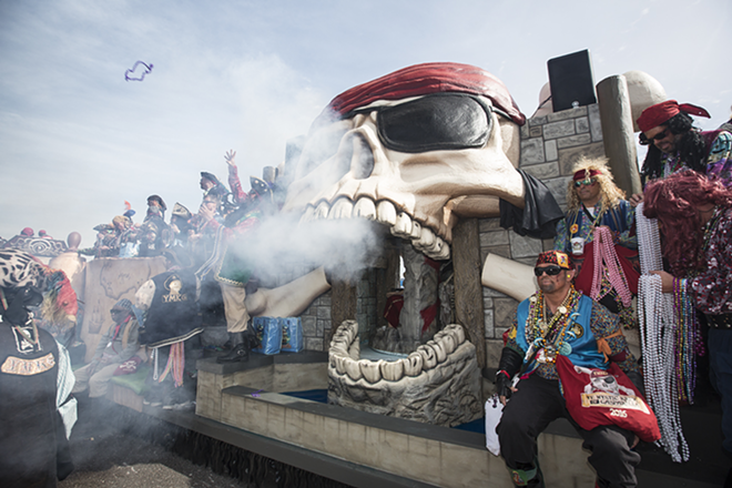 Ye Mystic Krewe of Gasparilla's newest float spews smoke from a huge skull. The float made its Gasparilla debut on Saturday. - Chip Weiner