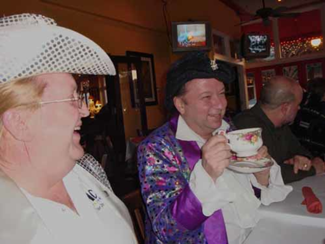 IT'S NOT WATER: Mark Bias explains his trademark teacup at Streetcar Charlie's while Carrie West looks on. - Larry Biddle