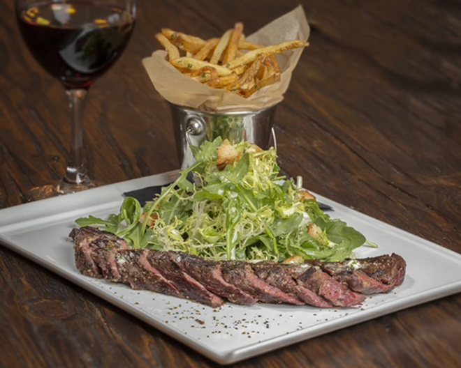Steak frites with garlic-parsley butter and mixed greens. - Chip Weiner