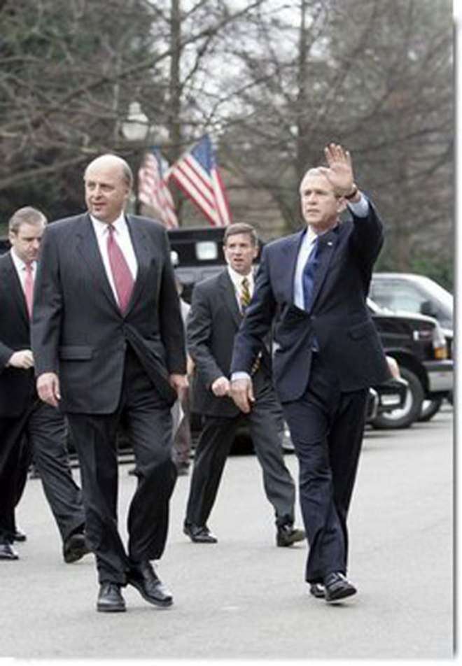 Director of National Intelligence John Negroponte and President George W. Bush in February 2005. Negroponte's job includes bringing to life a national domestic spying network the Bush administration calls the "Information Sharing Environment." - White House