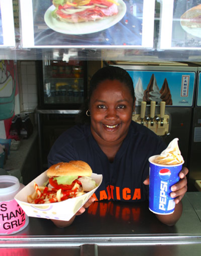 ORDER UP: Tasha Dunbar serves a cheeseburger meal deal with fries and a root beer float. - Eric Snider