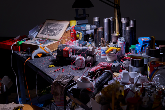 Gregory Green’s "Worktable #9, he of Righteousness" spurred the idea for a larger discussion about how the art and media worlds frame art, images and messages. - Museum of Fine Arts, St. Petersburg