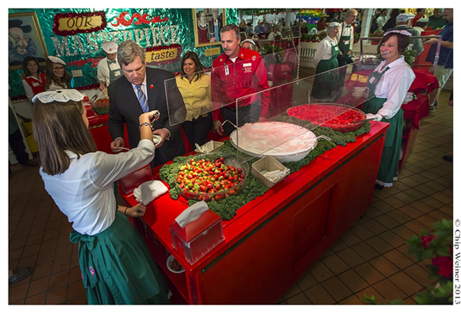United States Secretary of Agriculture Tom Vilsack pays a visit to the St. Clements Catholic Church strawberry shortcake booth. The exhibit has been a part of the strawberry festival for over 40 years. Vilsack was given a flat of specially selected strawberries from Parkesdale farm and then sampled shortcake Plant City style - CHIP WEINER