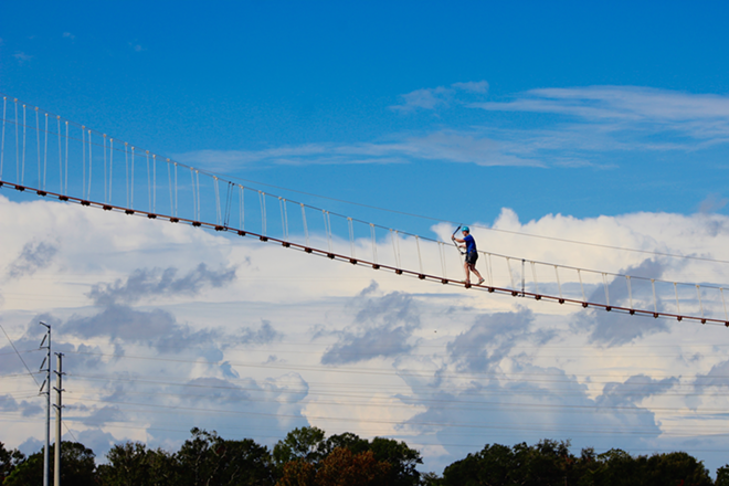 Crossing the 200-foot suspension bridge overlooking Tampa Bay. - Steph Waechter