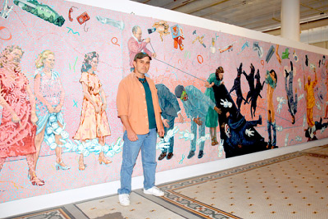 MEET THE ARTIST: Jeff Whipple stands before one of his murals in his Centro Ybor museum. - Marina Williams