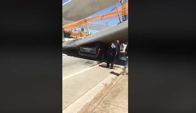 A Facebook user streamed dramatic video from the scene of the pedestrian bridge collapse that killed at least six in South Florida Thursday. - Screen grab