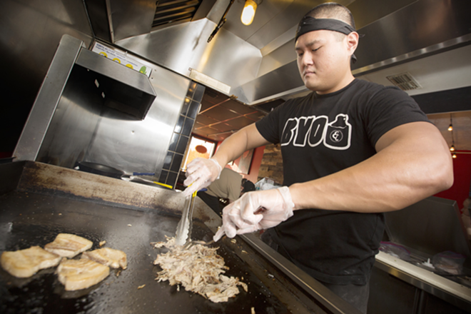 Steve Sera, co-owner of Chop Chop Shop, prepares pork belly. - Chip Weiner