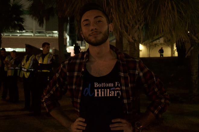 Vincent Roth posing with his shirt: I'd Bottom For Hillary.  - Ainhoa Palacios