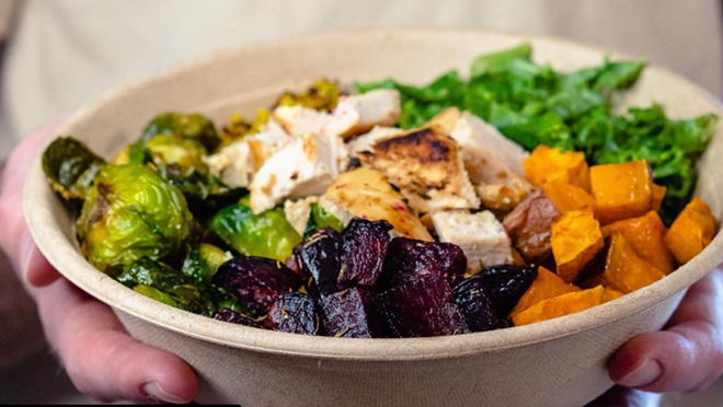 Little Leon's fall harvest bowl with roasted sweet potatoes, Brussel sprouts, beets, fresh kale, grilled chicken, and quinoa, then topped with pumpkin seeds and our sweet maple dressing - eatlittleleon/Instagram