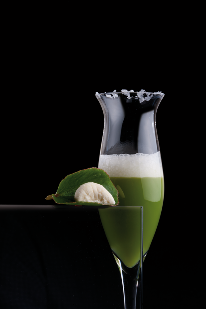 Adrià's green almond juice with almond air, bitter almond and yogurt powder polvorónes, begonia leaf, rimmed with prune kernel oil and salt flakes (Cold Tapas 2008). - ©elBulliArchive/Francesc Guillamet