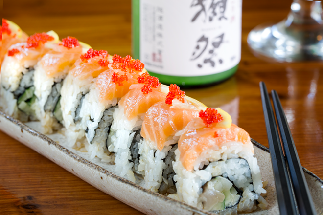 Salmon, lemon zest and roe top the Orange Sunrise, a spicy yellowtail and cucumber roll. - Chip Weiner