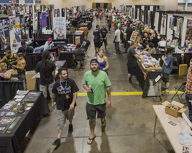 BUYERS' MARKET: The 2014 Tampa tattoo arts convention had dozens of tables of  tattoo artists and supply vendors. - Chip Weiner